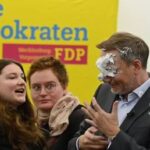 German politician hit with fake cake during campaign event (VIDEO)